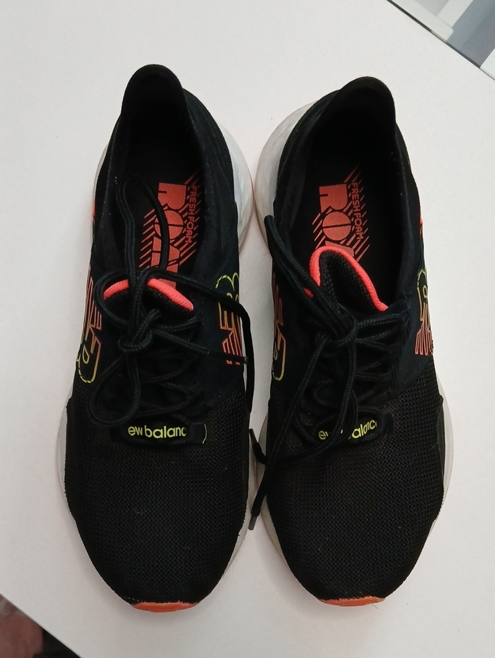 New Balance Black Sneakers with Coral and Yellow Accents